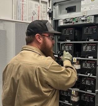 Technician working on UPS