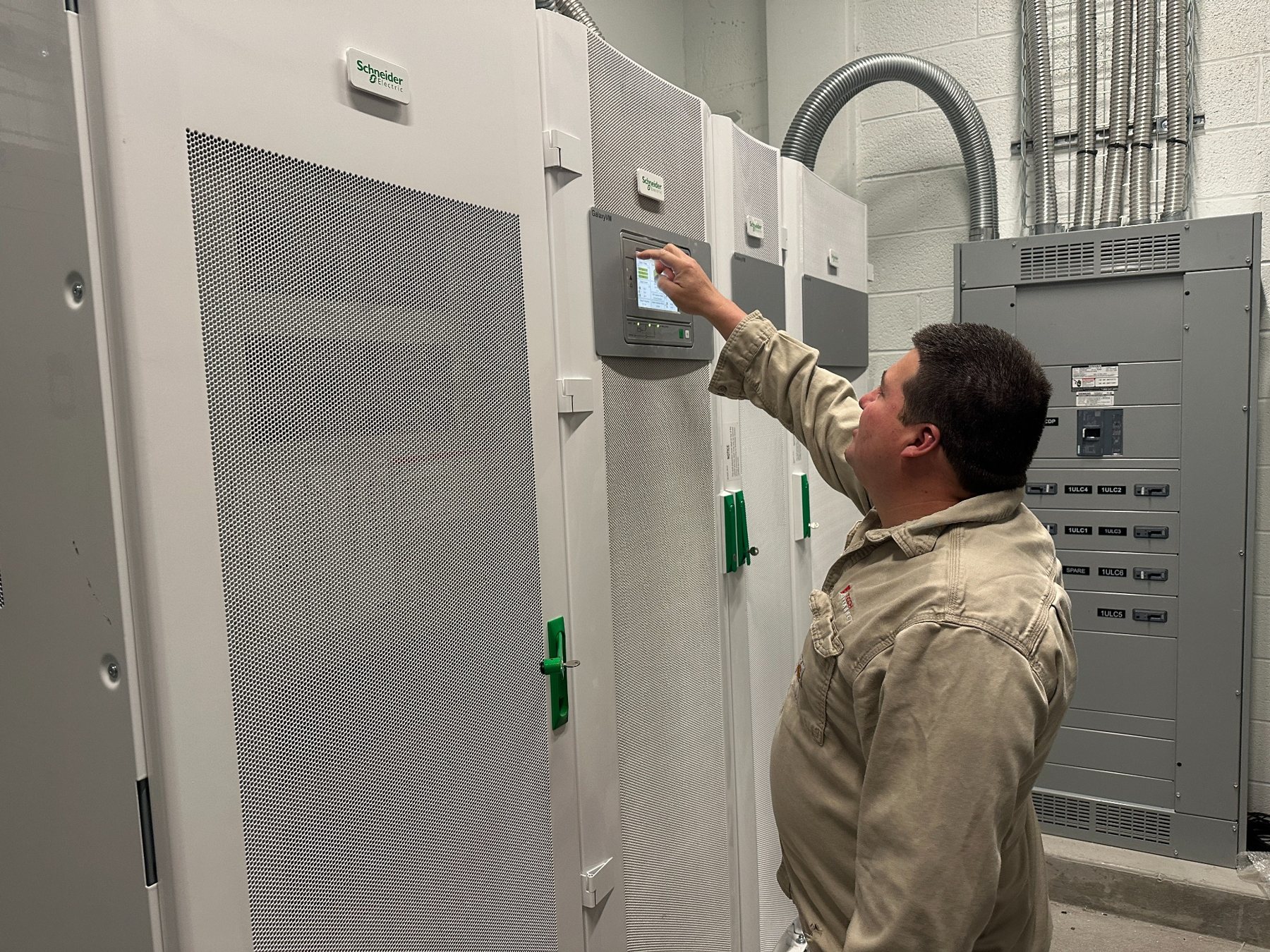 Technician servicing UPS equipment